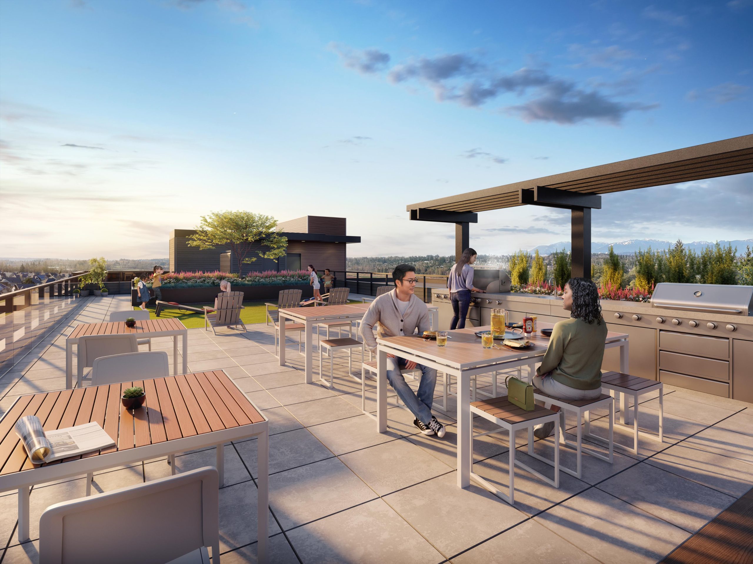 Rooftop terrace rendering at Clayton Crest showing people sitting at modern wooden picnic tables next to a stainless steel outdoor barbecue kitchen station with scenic mountain views