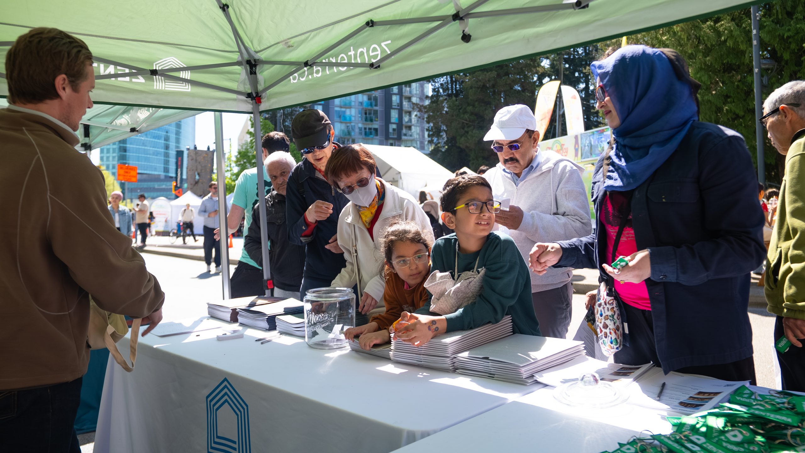Families and community members visiting the Zenterra booth at Surrey's Party for the Planet