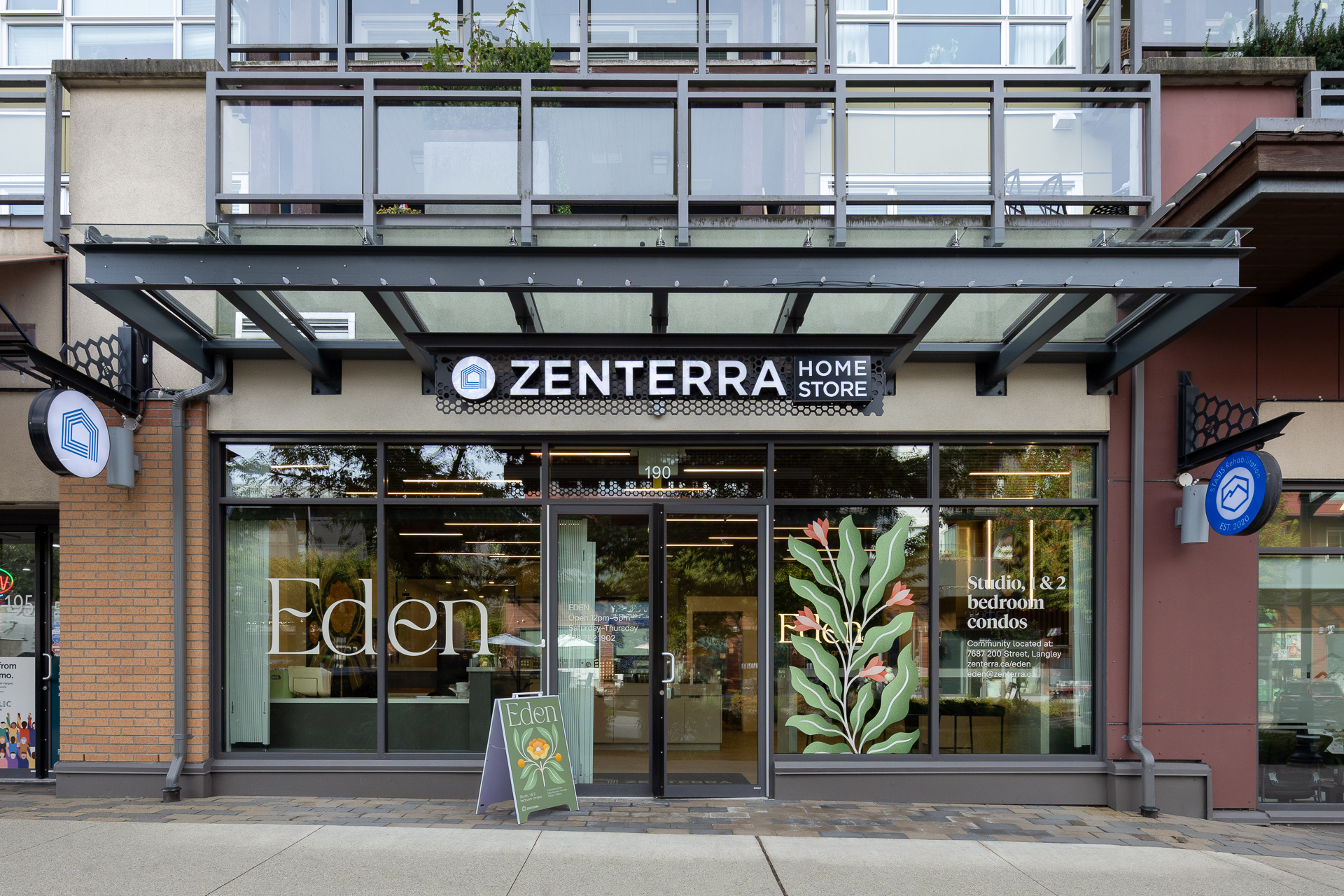 Zenterra Home Store storefront featuring Eden presale condos window graphics and signage