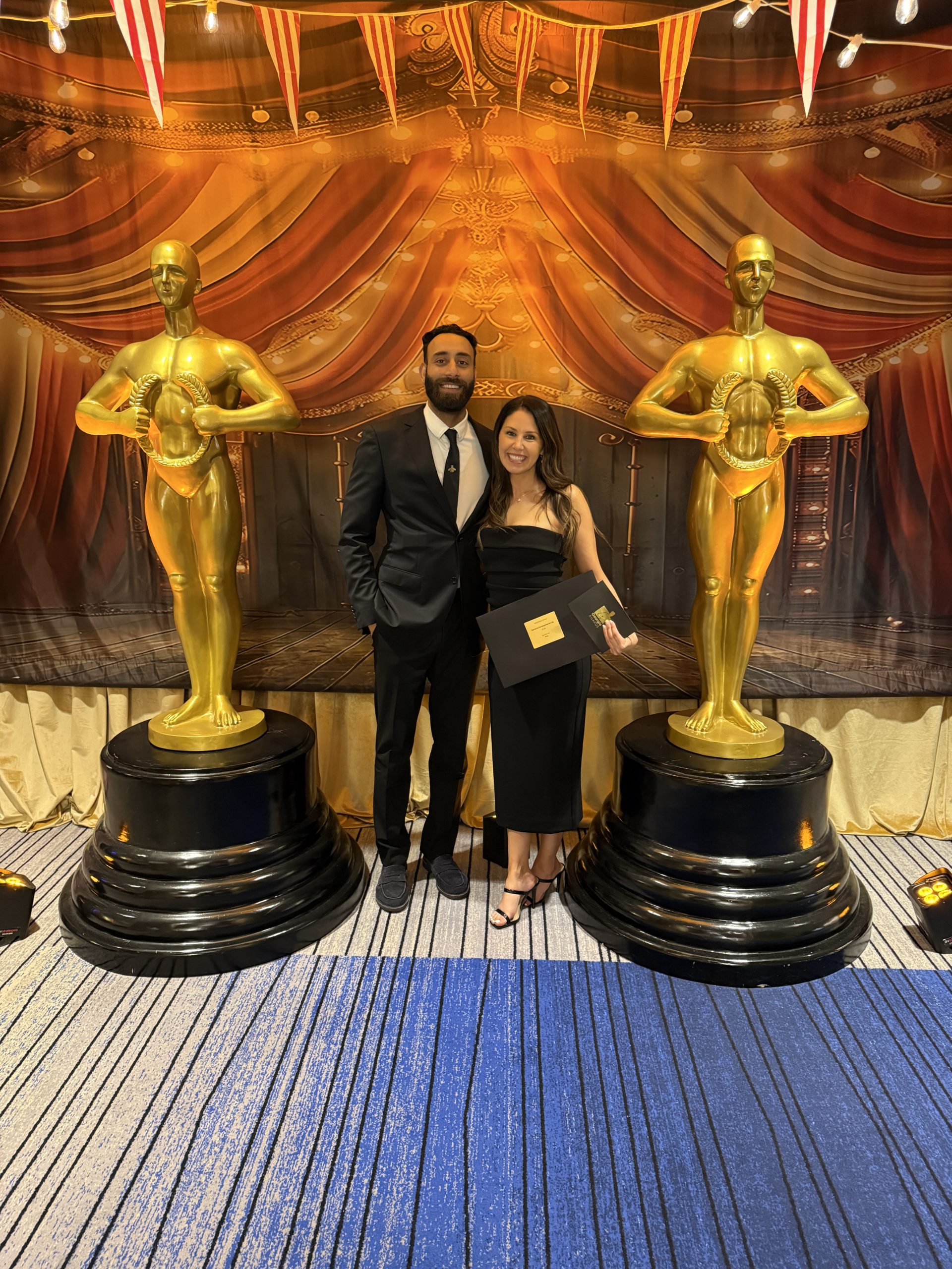 Zenterra Developments team members posing with gold trophies at the Georgie Awards photo booth