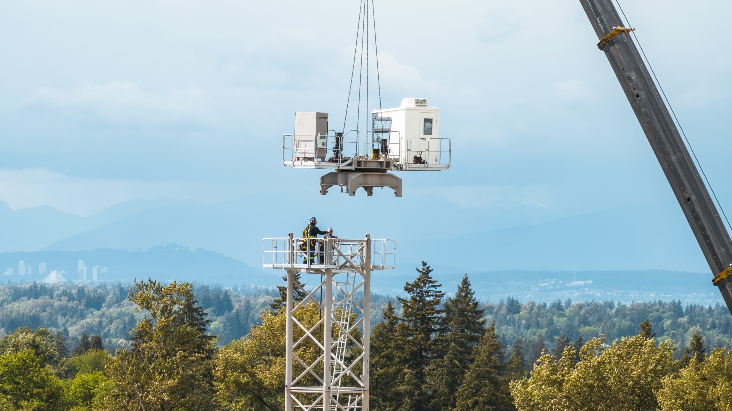 Tower crane cab installation milestone at Solana condo construction site in Willoughby Langley