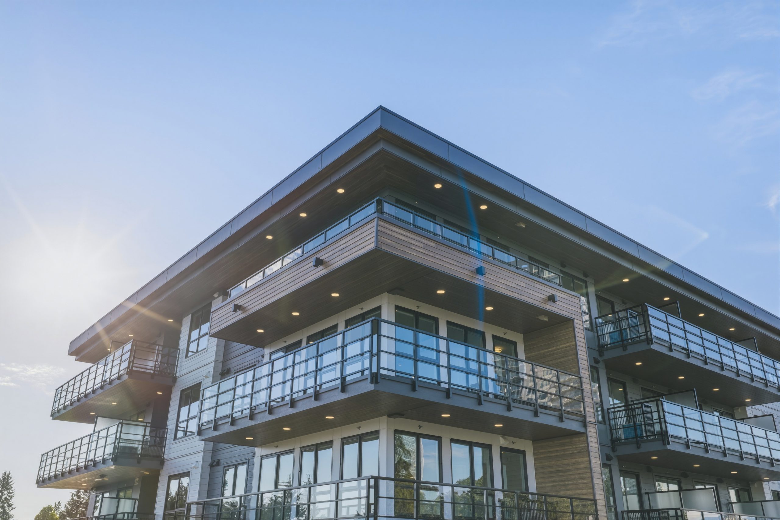 Zenterra's Modern low rise condo building exterior with glass balconies in the Fraser Valley housing market